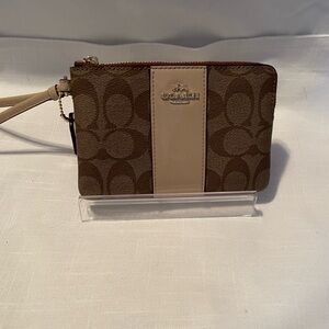 Coach Wristlet EUC Brown and Cream. Lightly sparkles/glitters in center & tag